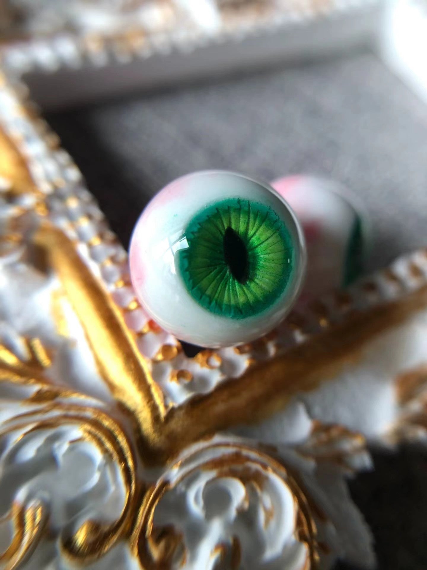 Green Eye Stud Earrings close-up - Green eye stone setting details