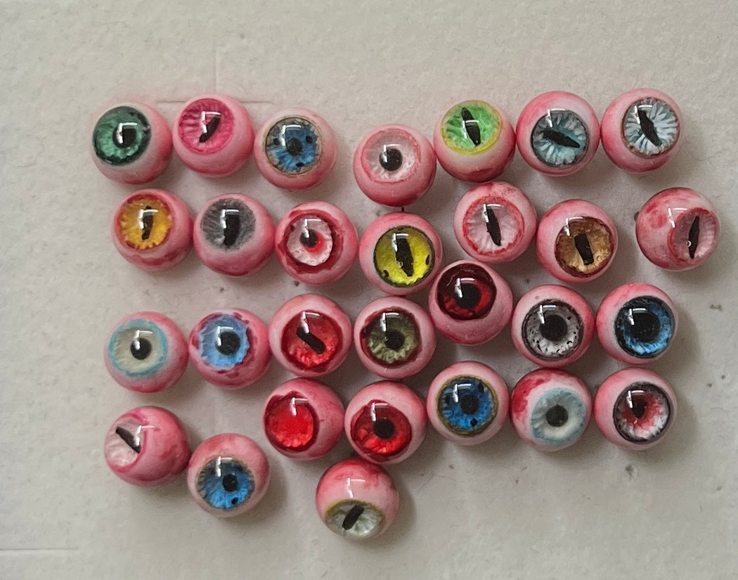 handmade creepy cute resin eyeball jewelry charms in multiple colors by NocturneCraft