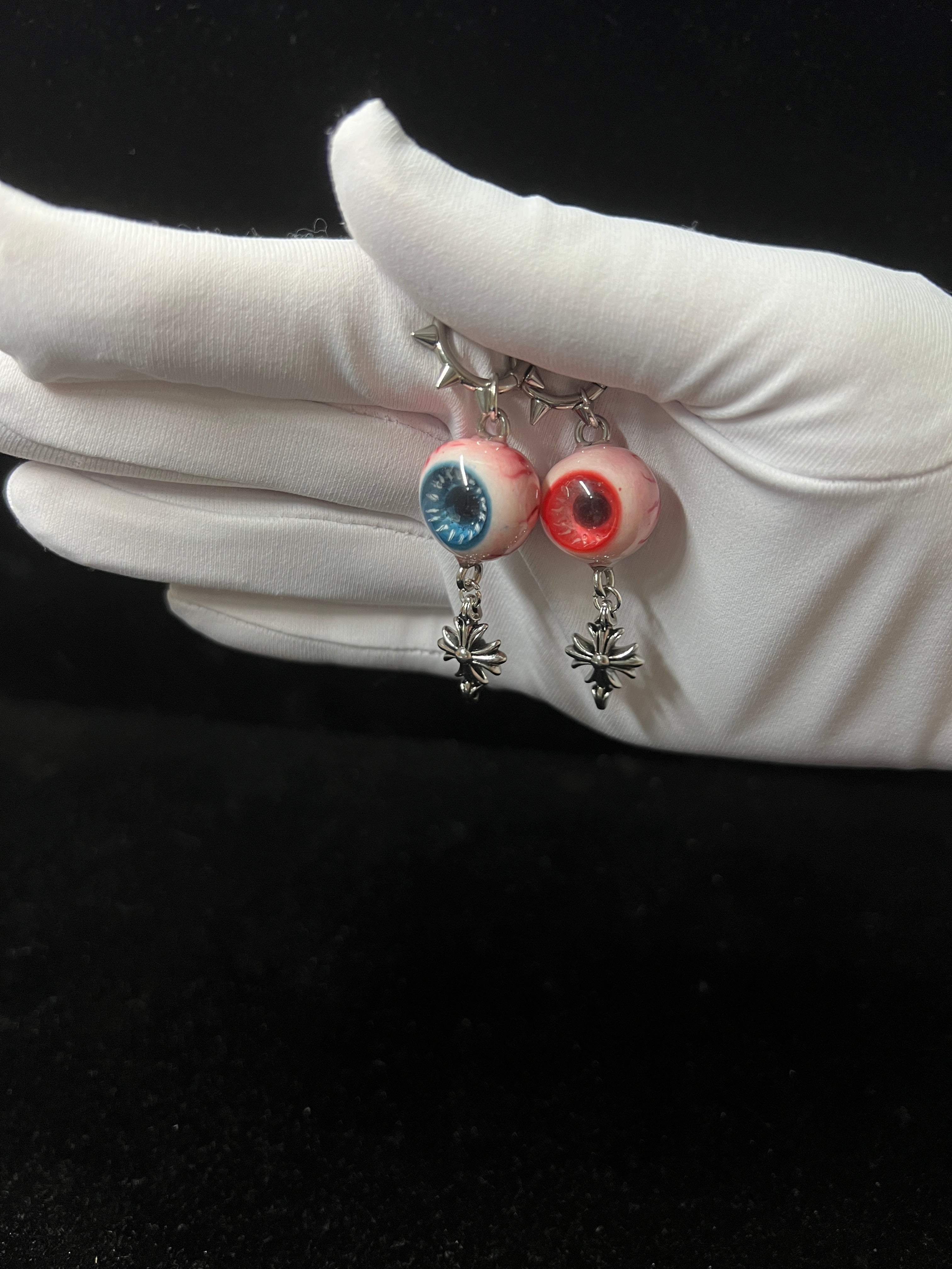 blue and red earrings with eyeball design pastel goth resin jewelry