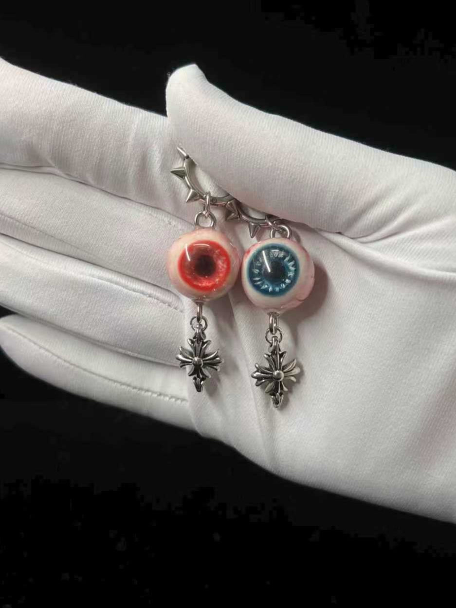 blue and red earrings with eyeball design pastel goth resin jewelry